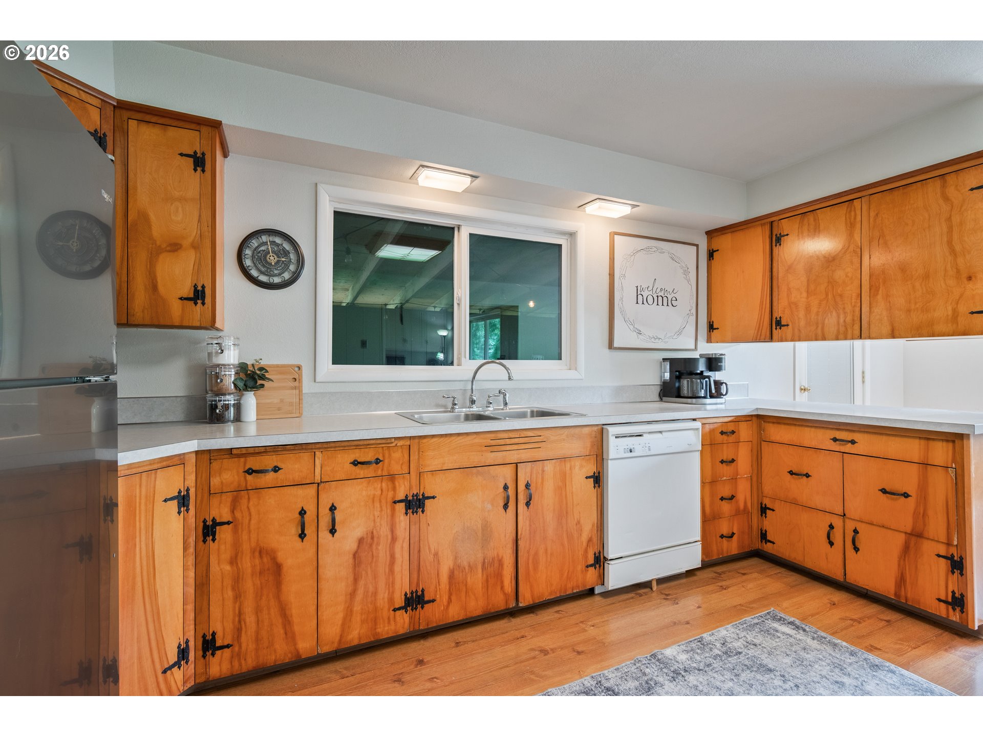 1304 Coal Creek Road Longview, WA 98632 - Photo 6 of 44 a large kitchen with stainless steel appliances granite countertop a sink and cabinets