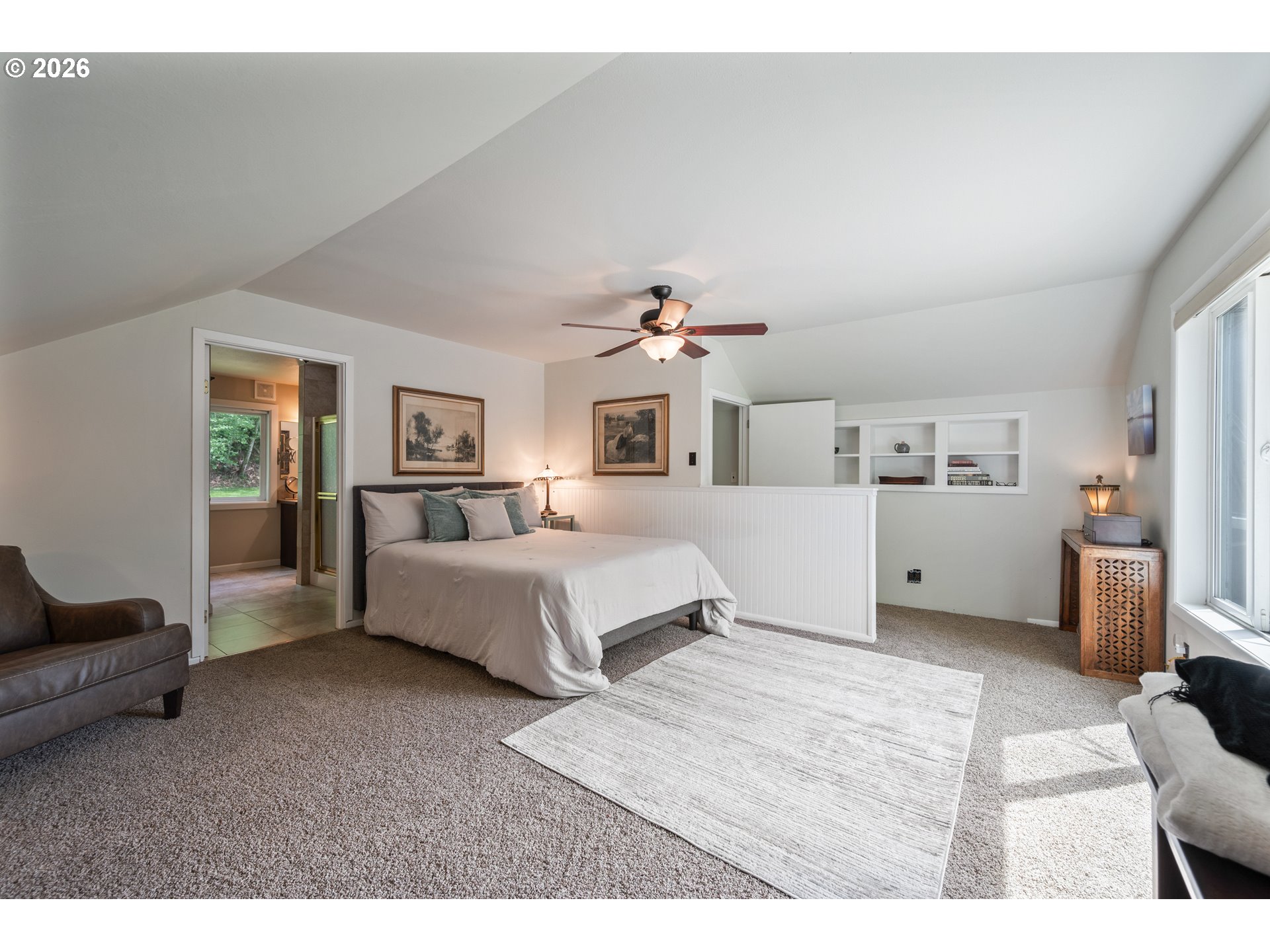 1304 Coal Creek Road Longview, WA 98632 - Photo 7 of 44 a spacious bedroom with a bed and a couch