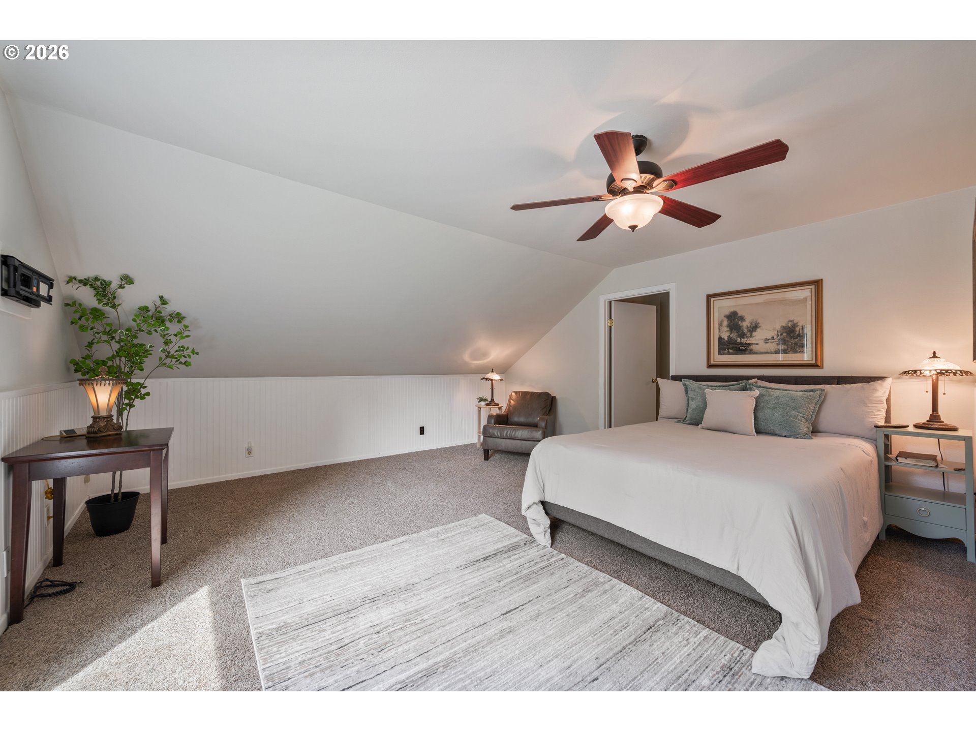 1304 Coal Creek Road Longview, WA 98632 - Photo 8 of 44 a bedroom with a bed chandelier and a potted plant
