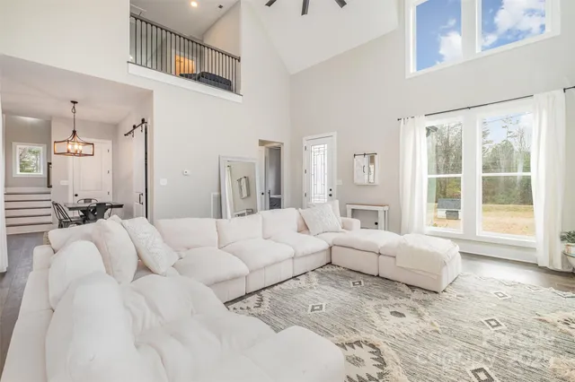 a large white bed in a white room