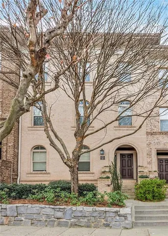 a front view of a house with yard
