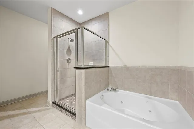 a bathroom with a bathtub and a shower