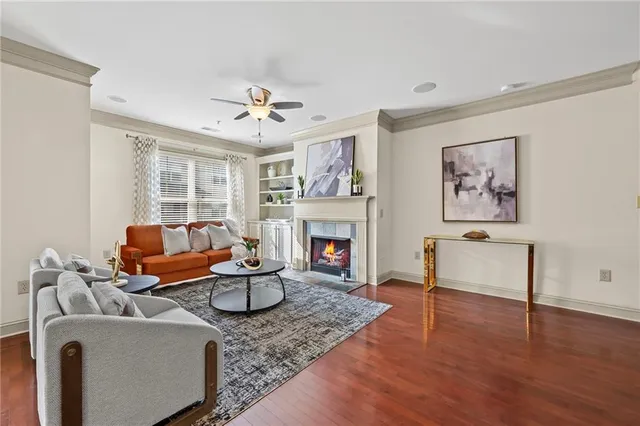 a living room with furniture fireplace and window
