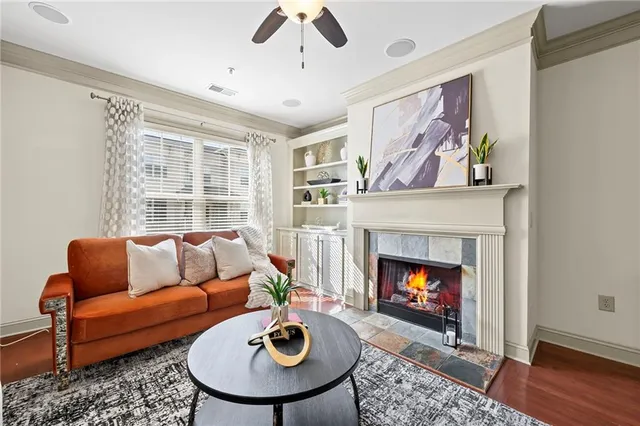 a living room with furniture and a fireplace
