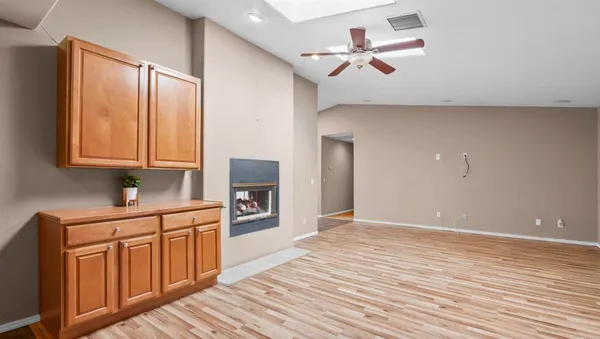 a kitchen with stainless steel appliances granite countertop sink stove and refrigerator