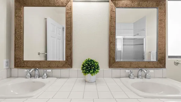 a bathroom with a shower and a glass door