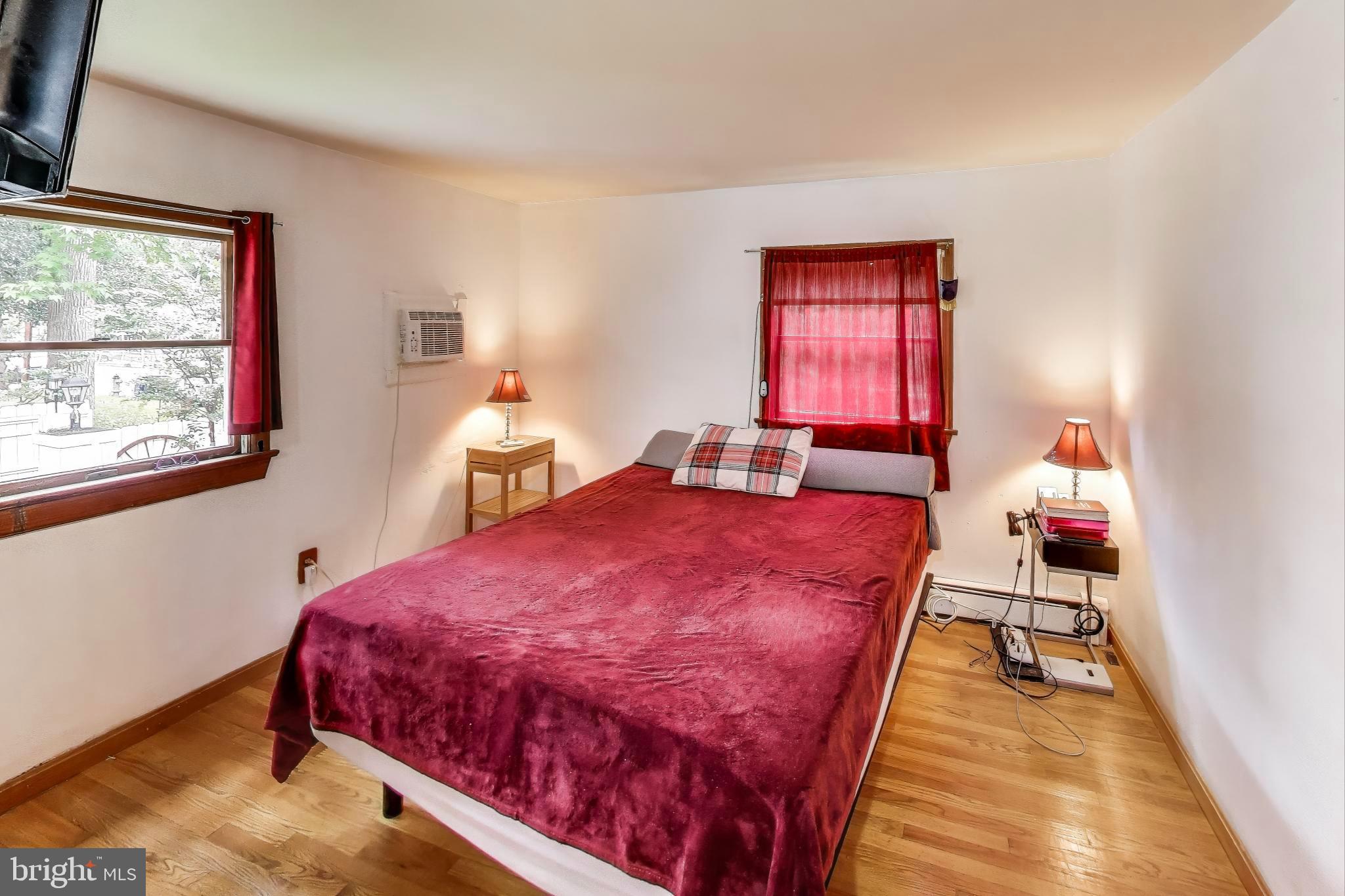 9211 Fowler Lane Lanham, MD 20706 - Photo 17 of 50 a bed room with a bed and two windows