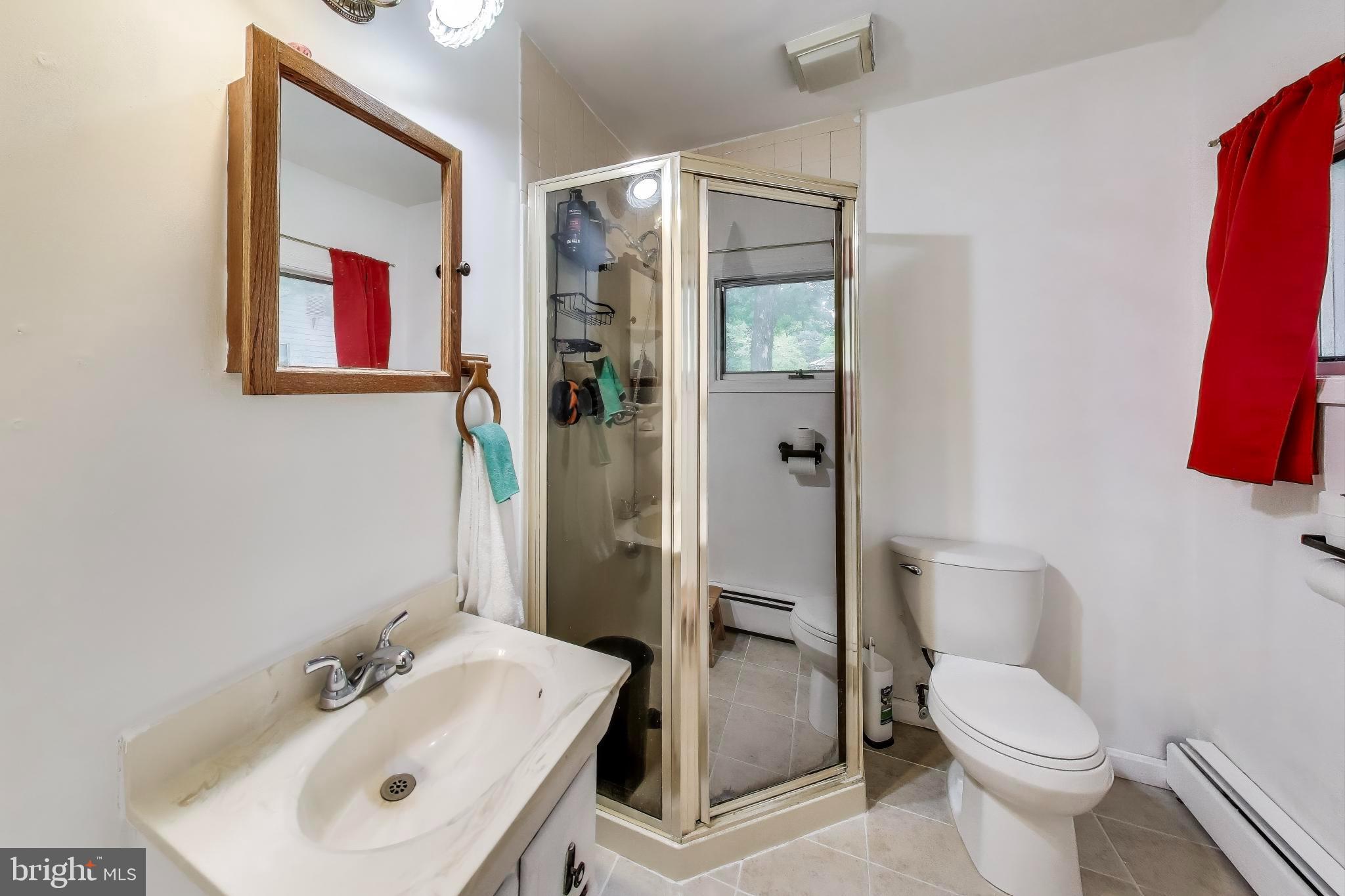 9211 Fowler Lane Lanham, MD 20706 - Photo 20 of 50 a bathroom with a sink and a toilet