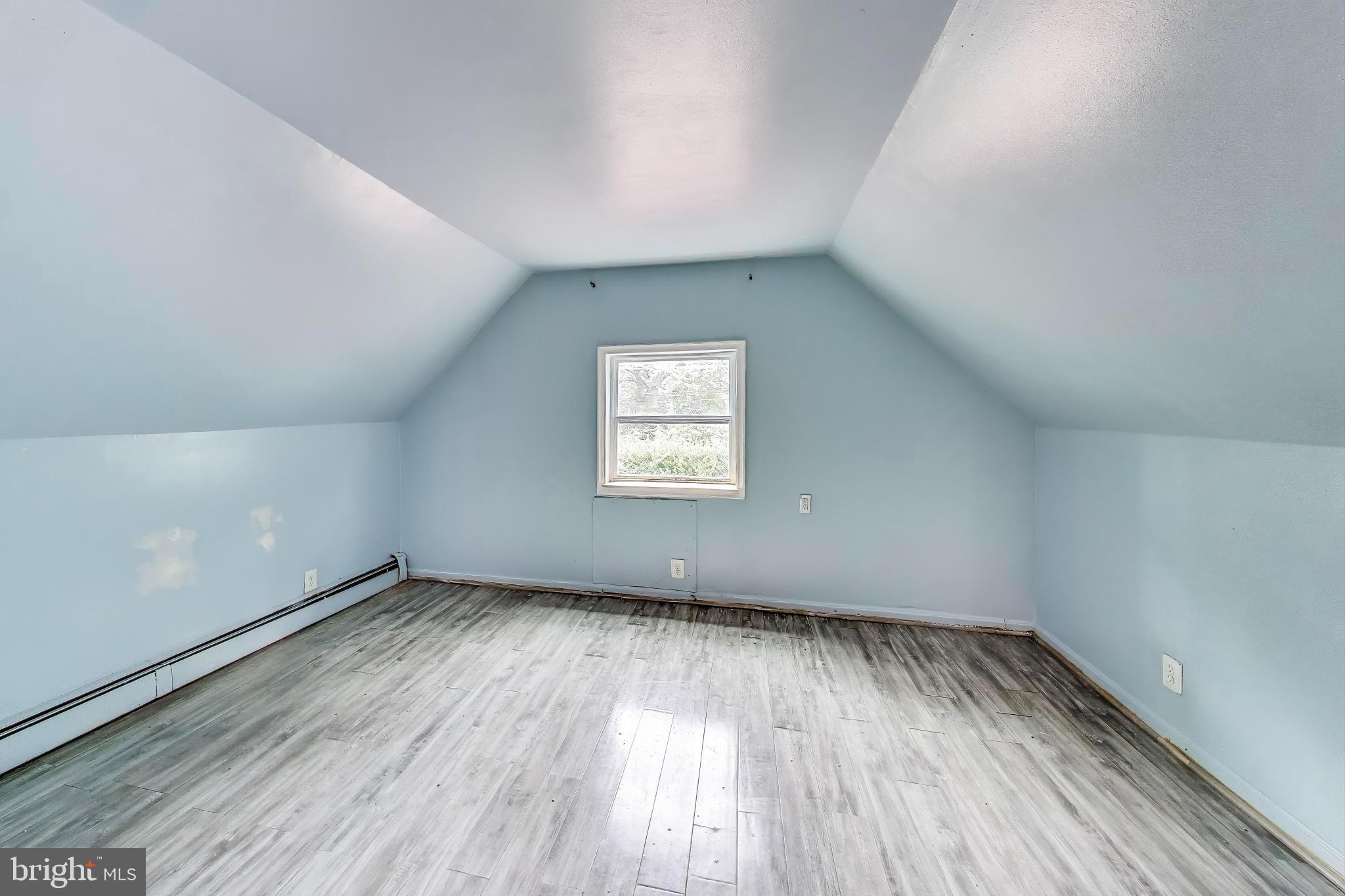 9211 Fowler Lane Lanham, MD 20706 - Photo 24 of 50 an empty room with wooden floor and windows