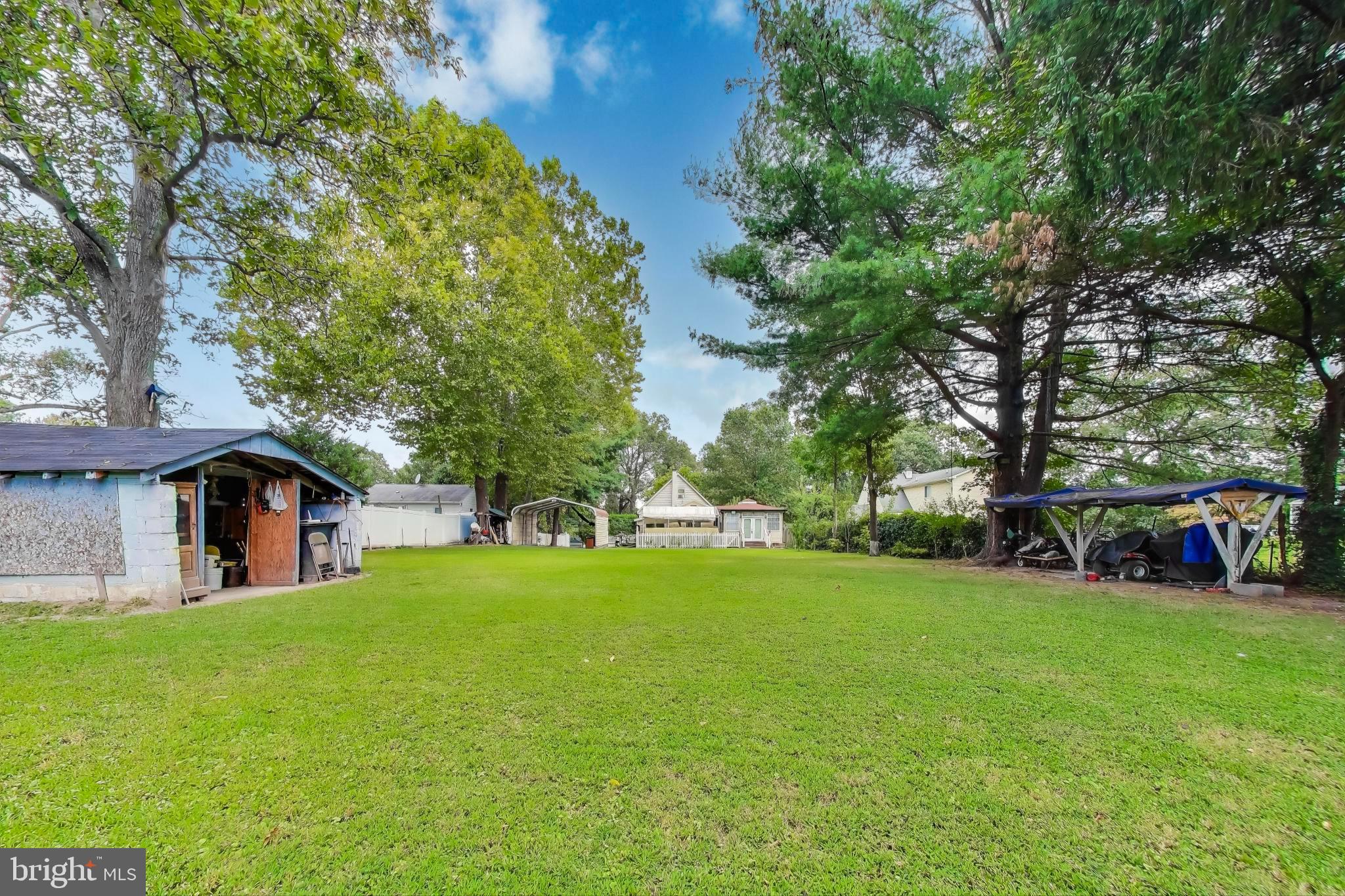 9211 Fowler Lane Lanham, MD 20706 - Photo 44 of 50 a view of a house with a big yard and large trees