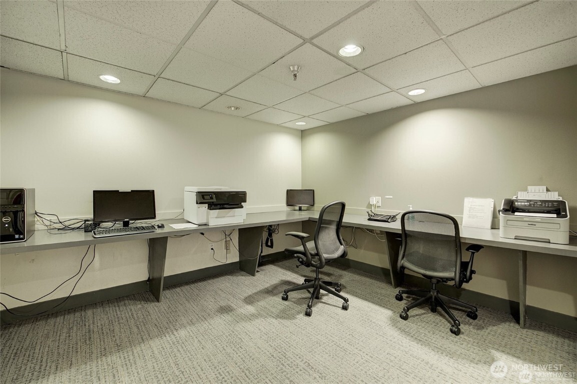 1415 2nd Avenue, Unit 1209 Seattle, WA 98101 - Photo 21 of 21 a view of a workspace with furniture and a window