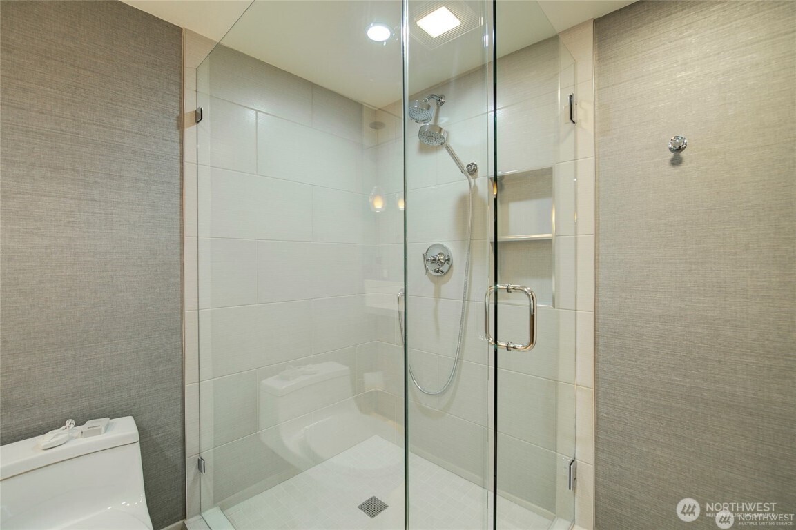 1415 2nd Avenue, Unit 1209 Seattle, WA 98101 - Photo 3 of 21 a bathroom with a shower and toilet