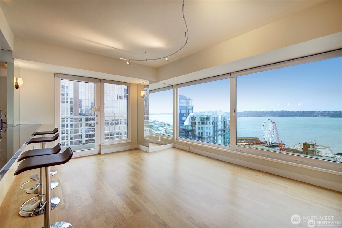 1415 2nd Avenue, Unit 1209 Seattle, WA 98101 - Photo 6 of 21 a hallway with a large window