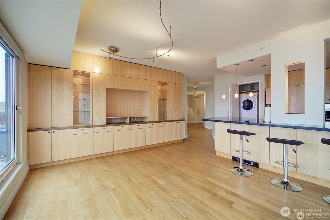 1415 2nd Avenue, Unit 1209 Seattle, WA 98101 - Photo 8 of 21 a large room with table and chairs