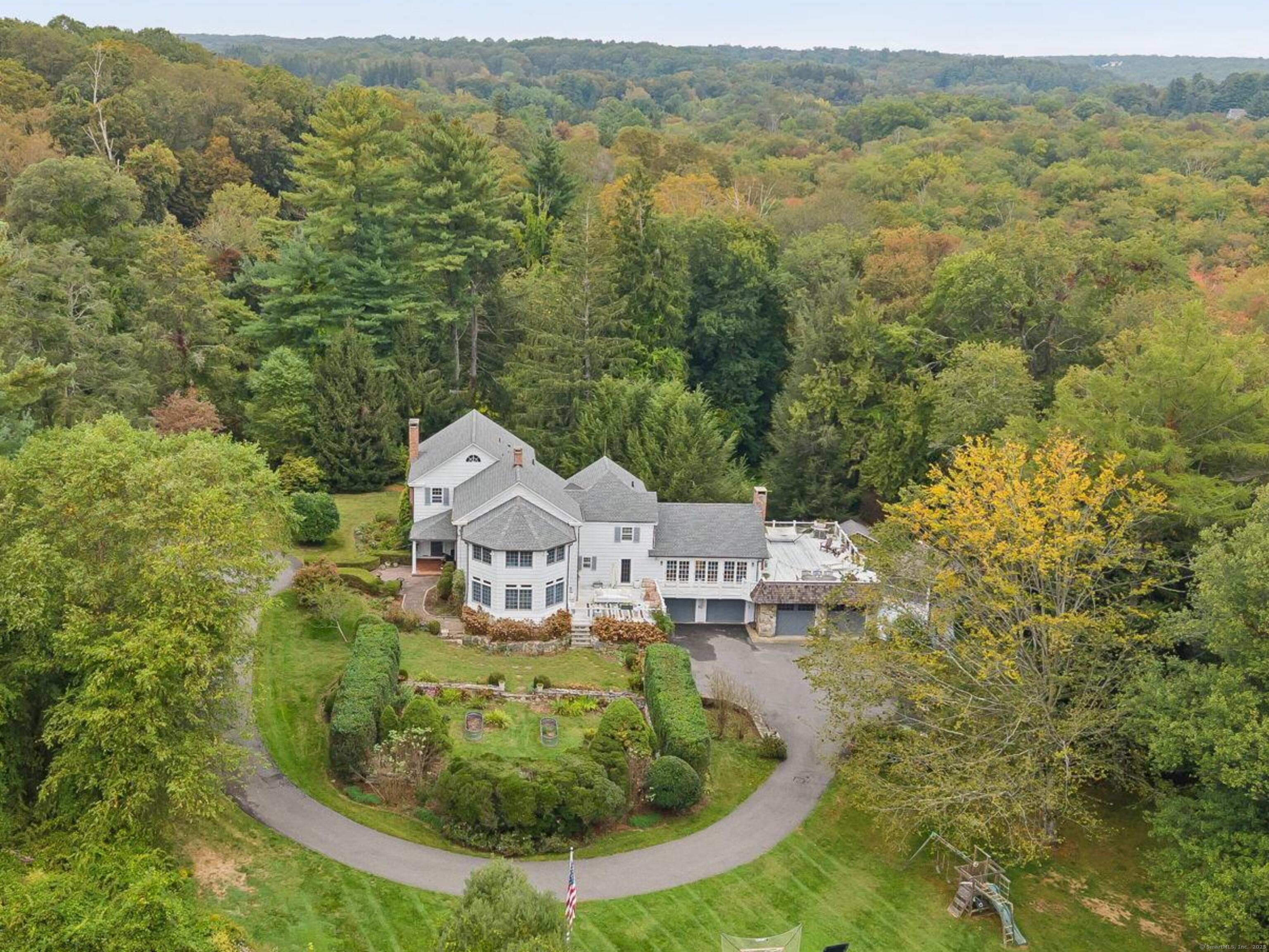 330 Ridgefield Road Wilton, CT 06897 - Photo 1 of 1 an aerial view of residential houses with outdoor space and trees