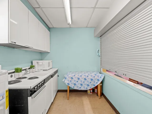 a bathroom with a sink a vanity and a window