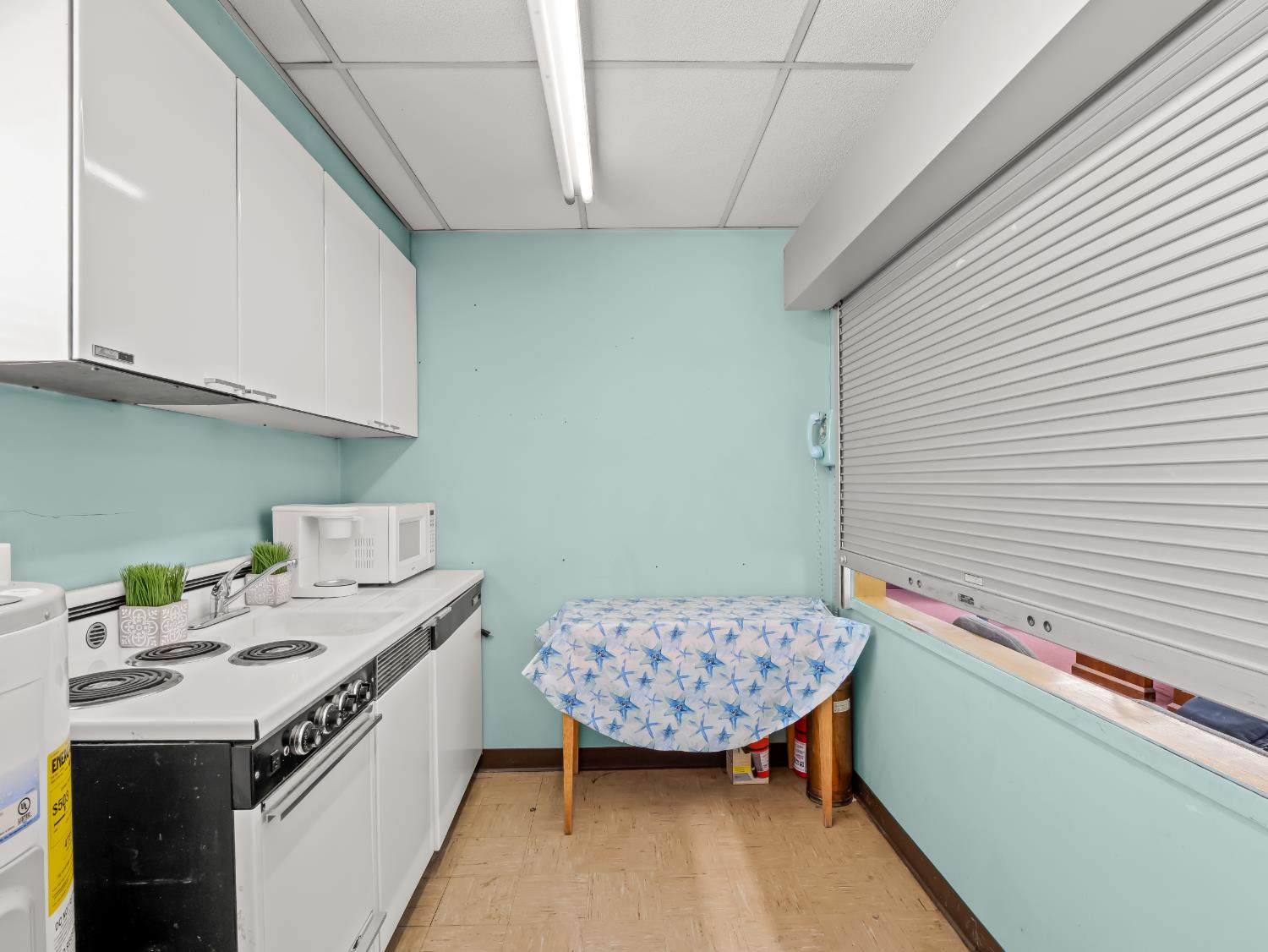 701 Mayor Avenue Fresno, CA 93706 - Photo 13 of 28 a bathroom with a sink a vanity and a window