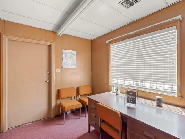 a kitchen with a sink cabinets and a window
