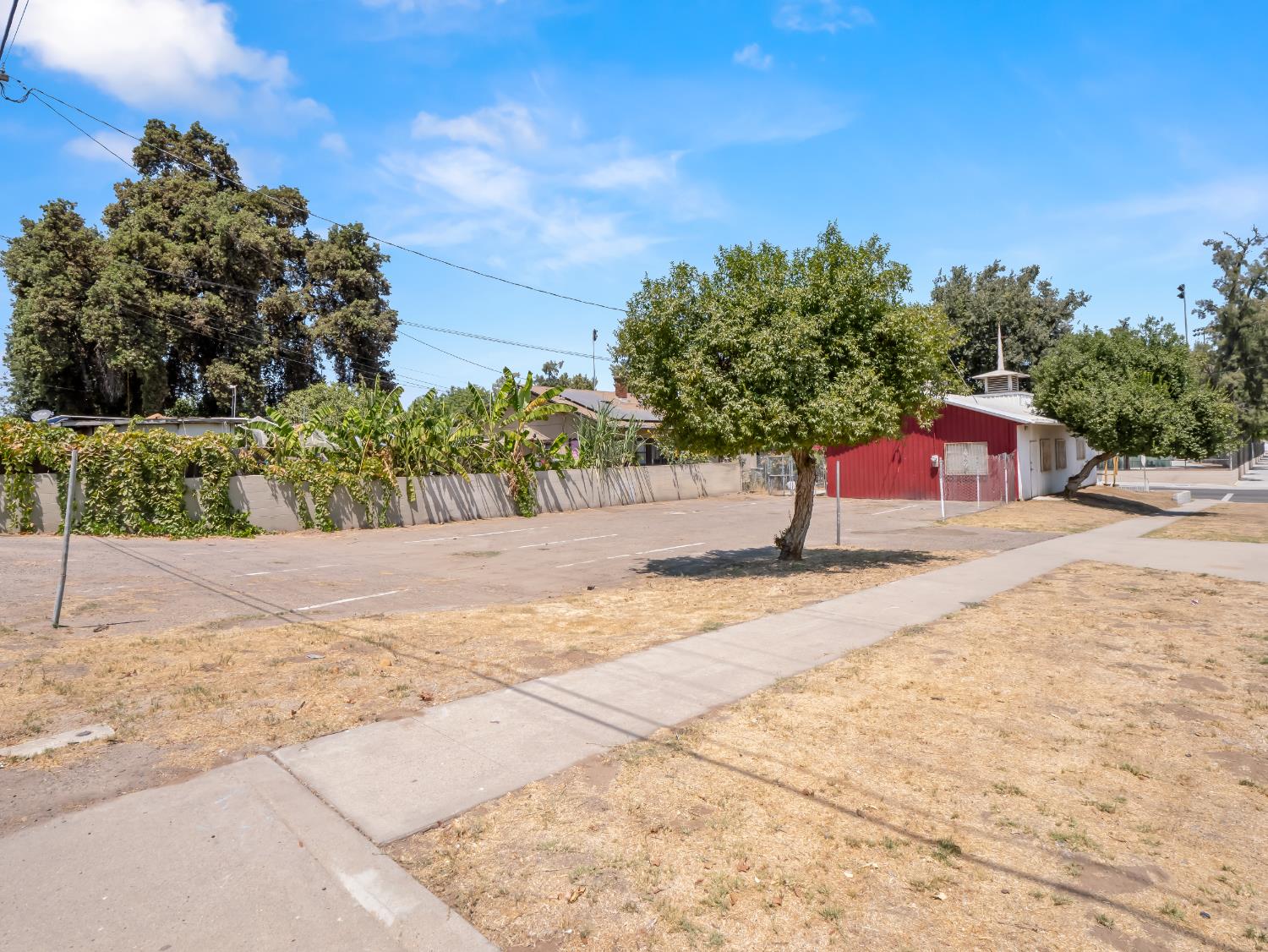 701 Mayor Avenue Fresno, CA 93706 - Photo 27 of 28 a street view with large trees