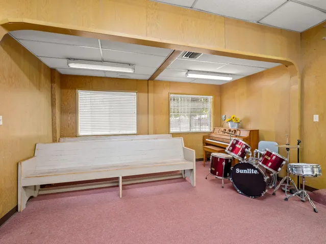 a bedroom with furniture and a chandelier