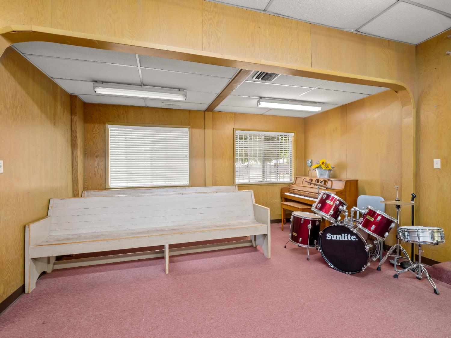 701 Mayor Avenue Fresno, CA 93706 - Photo 6 of 28 a bedroom with furniture and a chandelier