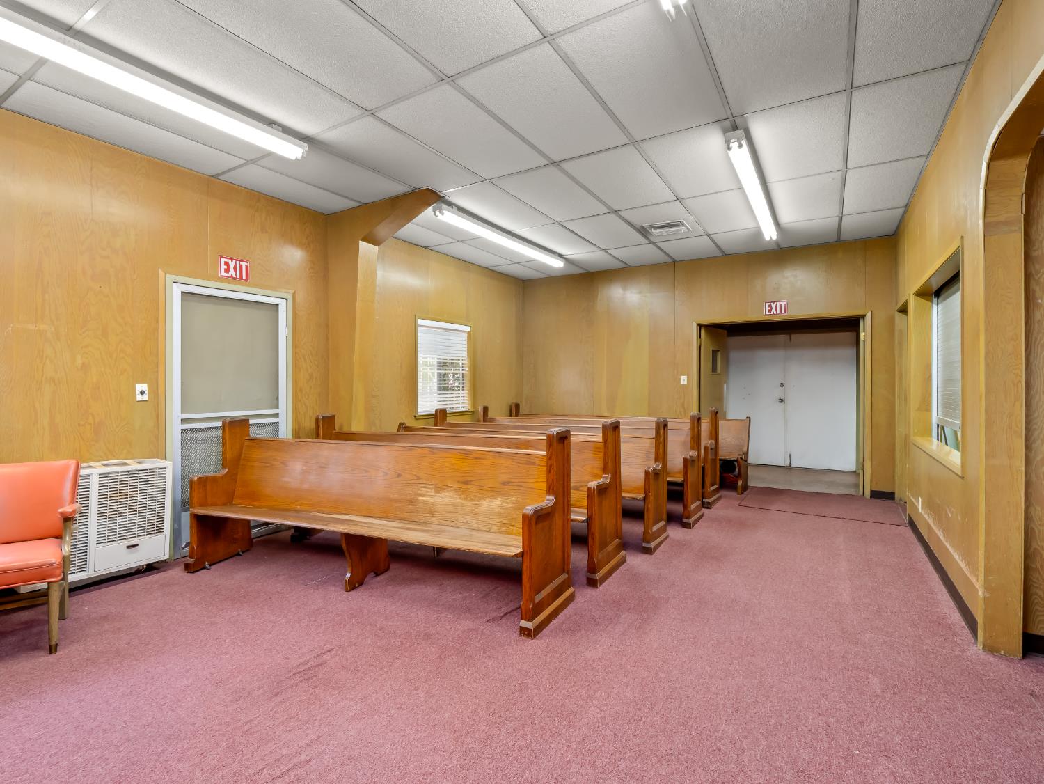701 Mayor Avenue Fresno, CA 93706 - Photo 10 of 28 a spacious bedroom with a bed and a chandelier