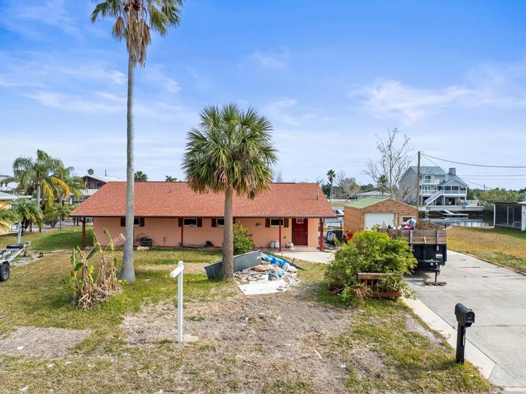 4102 Des Prez Court Hernando Beach, FL 34607 - Photo 2 of 52 a house view with a garden space