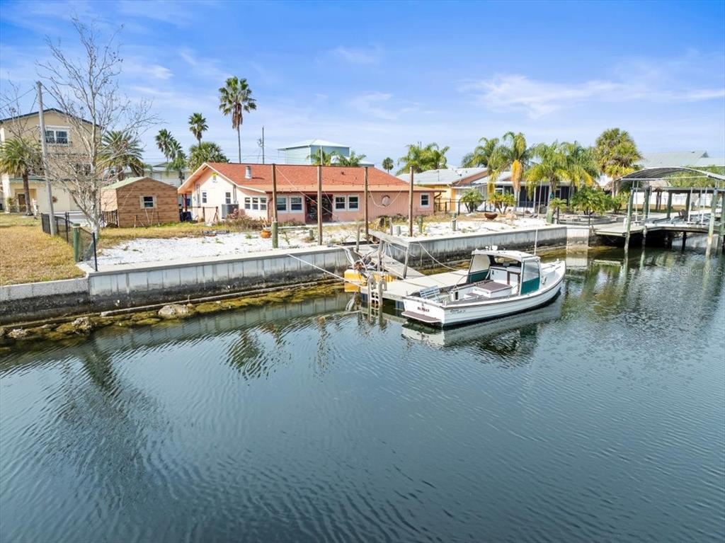 4102 Des Prez Court Hernando Beach, FL 34607 - Photo 21 of 52 a view of a swimming pool with outdoor seating