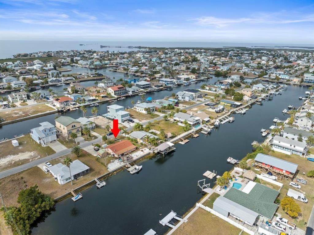 4102 Des Prez Court Hernando Beach, FL 34607 - Photo 23 of 52 an aerial view of residential houses with outdoor space