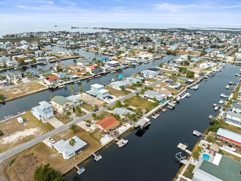 4102 Des Prez Court Hernando Beach, FL 34607 - Photo 31 of 52 an aerial view of a city with lawn chairs