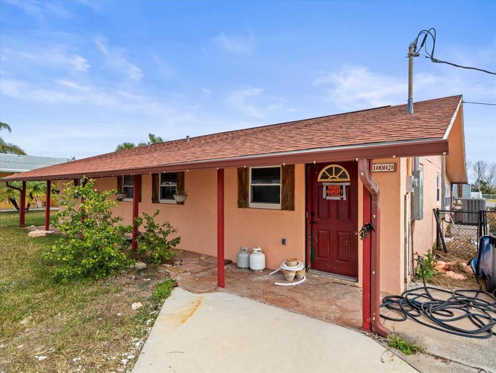 4102 Des Prez Court Hernando Beach, FL 34607 - Photo 34 of 52 a front view of a house with garden