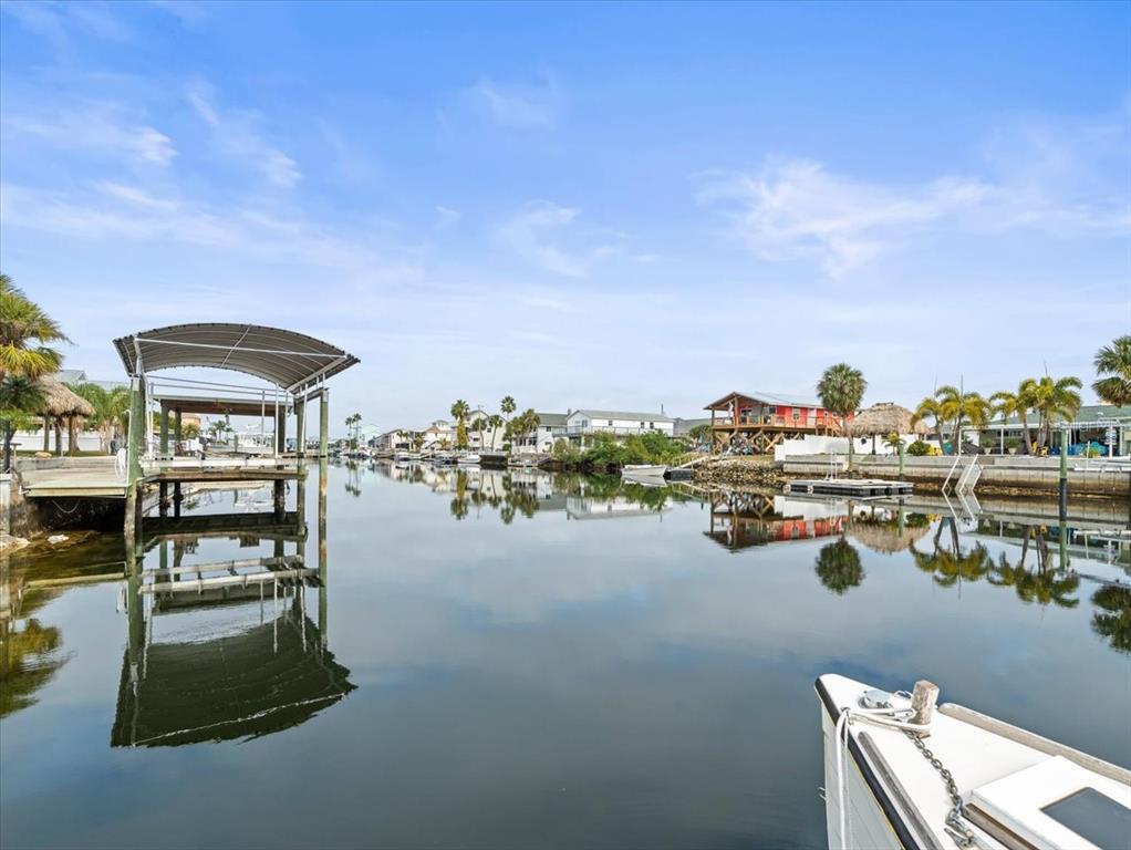 4102 Des Prez Court Hernando Beach, FL 34607 - Photo 38 of 52 a view of roof deck with dining table and chair a barbeque