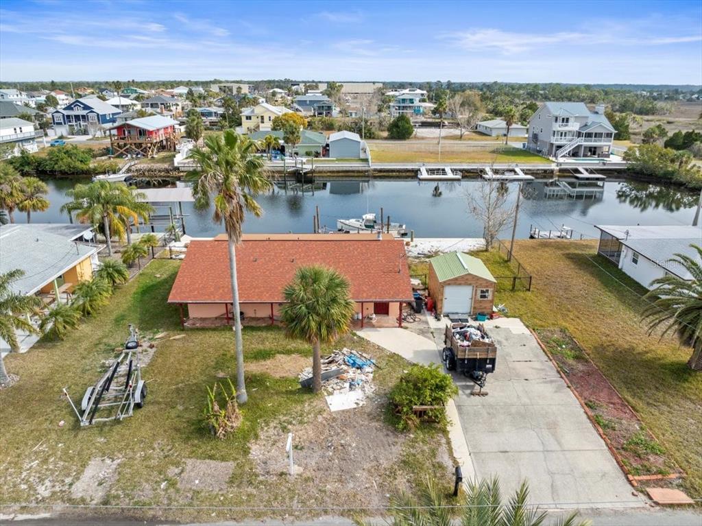 4102 Des Prez Court Hernando Beach, FL 34607 - Photo 4 of 52 an aerial view of a house with a yard