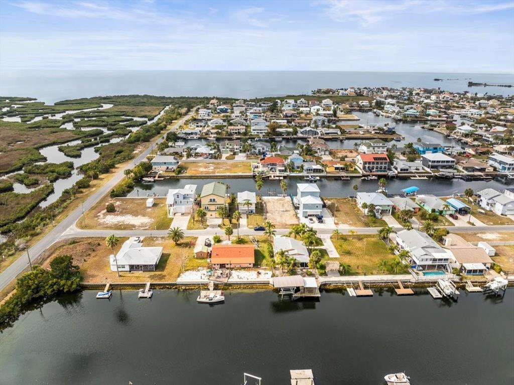 4102 Des Prez Court Hernando Beach, FL 34607 - Photo 43 of 52 an aerial view of residential houses with parking space