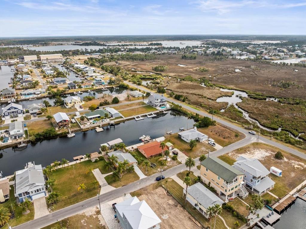 4102 Des Prez Court Hernando Beach, FL 34607 - Photo 46 of 52 an aerial view of ocean and residential houses with outdoor space