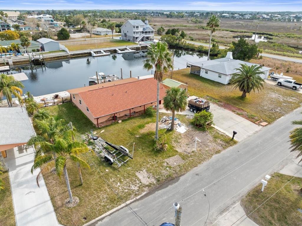 4102 Des Prez Court Hernando Beach, FL 34607 - Photo 8 of 52 an aerial view of a swimming pool with a yard