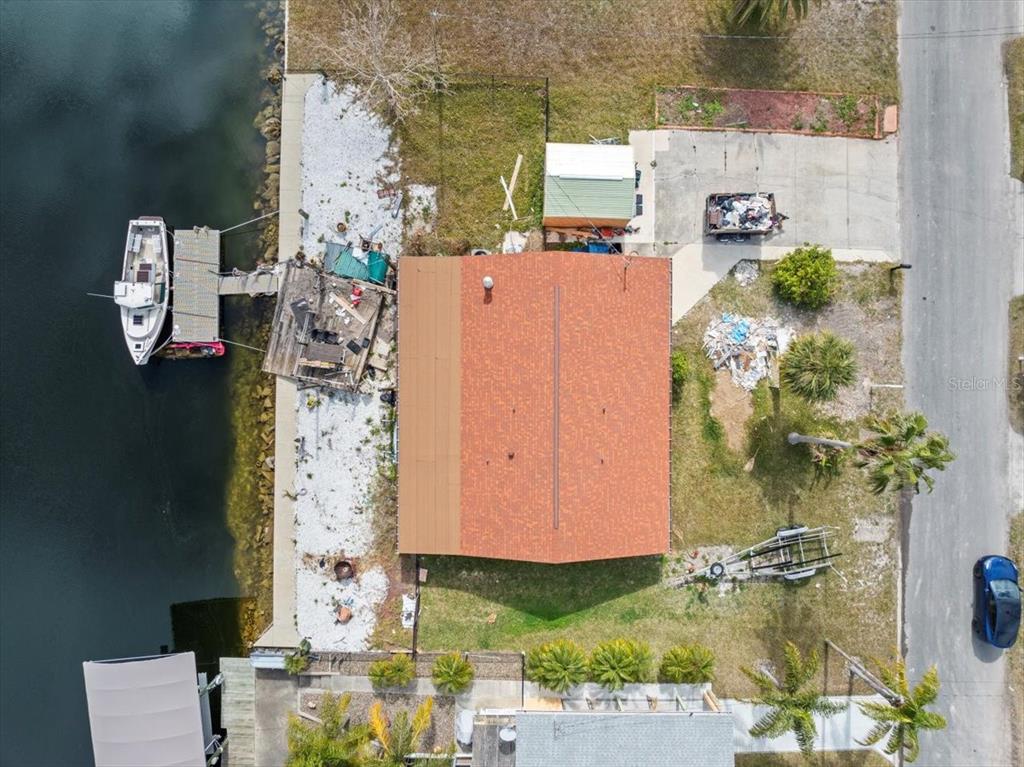 4102 Des Prez Court Hernando Beach, FL 34607 - Photo 10 of 52 aerial view of a house with a yard and large tree