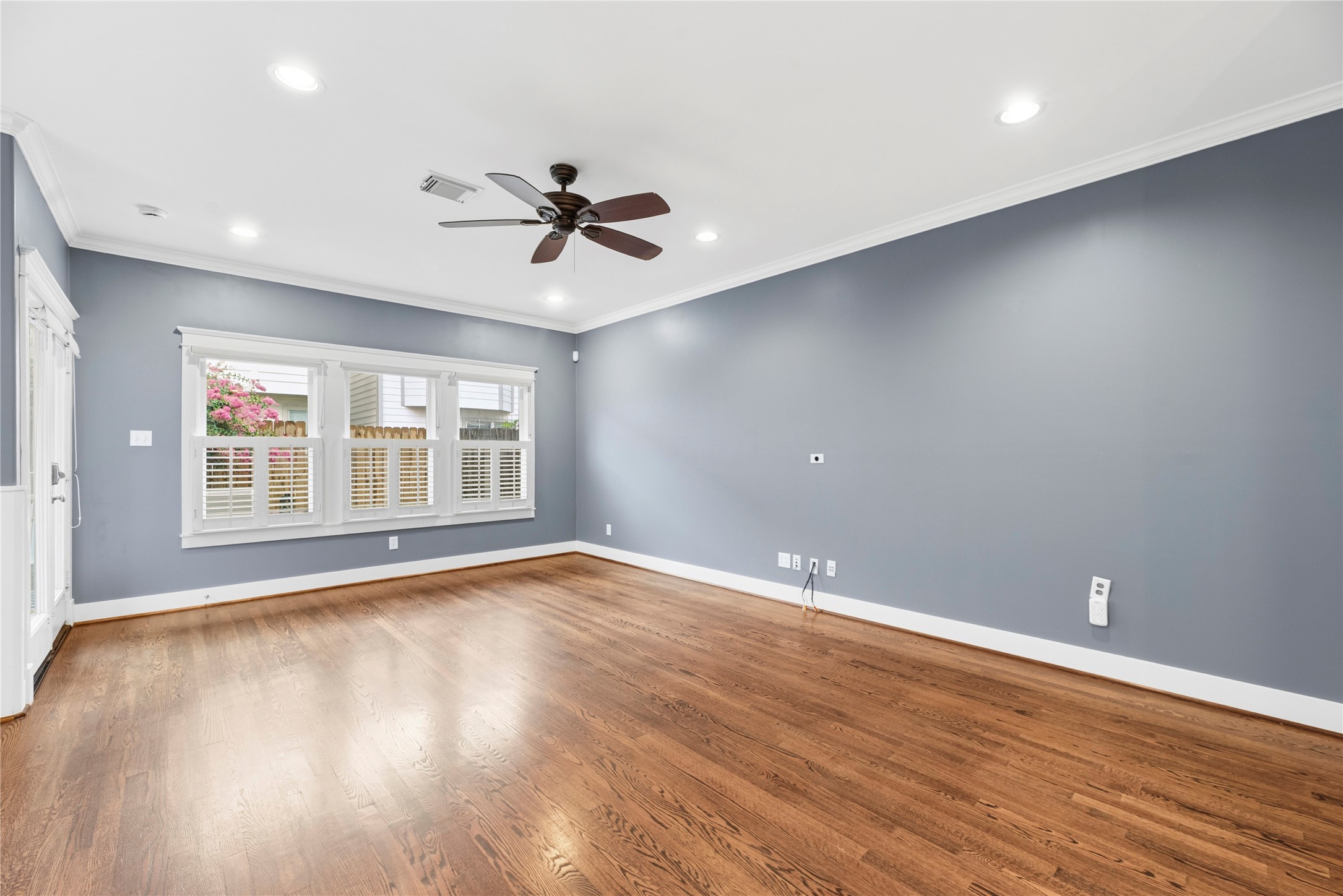 1505 Prince Street Houston, TX 77008 - Photo 6 of 39 Spacious Living Room offers ample natural light, plantation shutters, and gleaming hardwood floors.