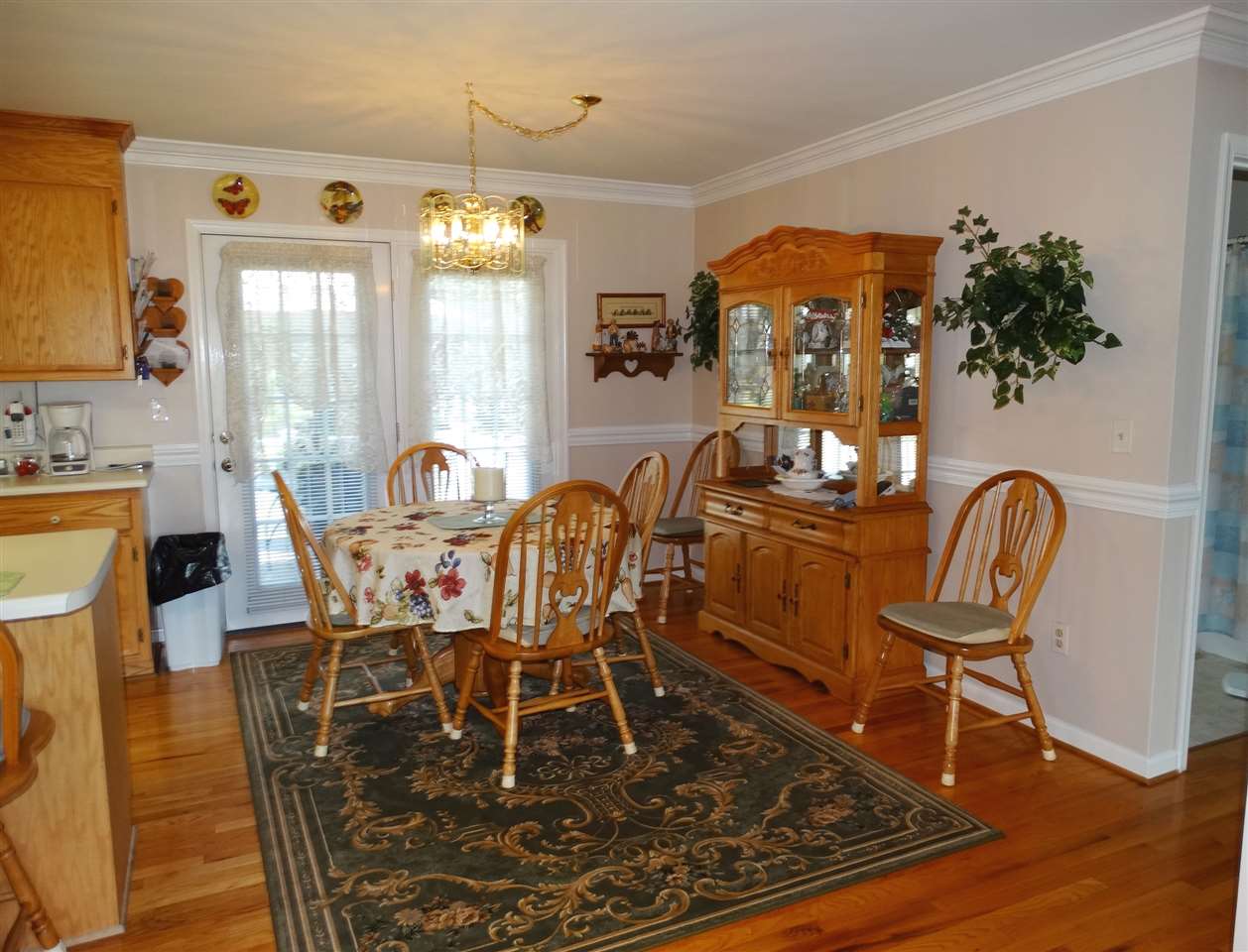 324 Good Hope Church Road Aroda, VA 22709 - Photo 18 of 32 a dining room with furniture a chandelier and wooden floor