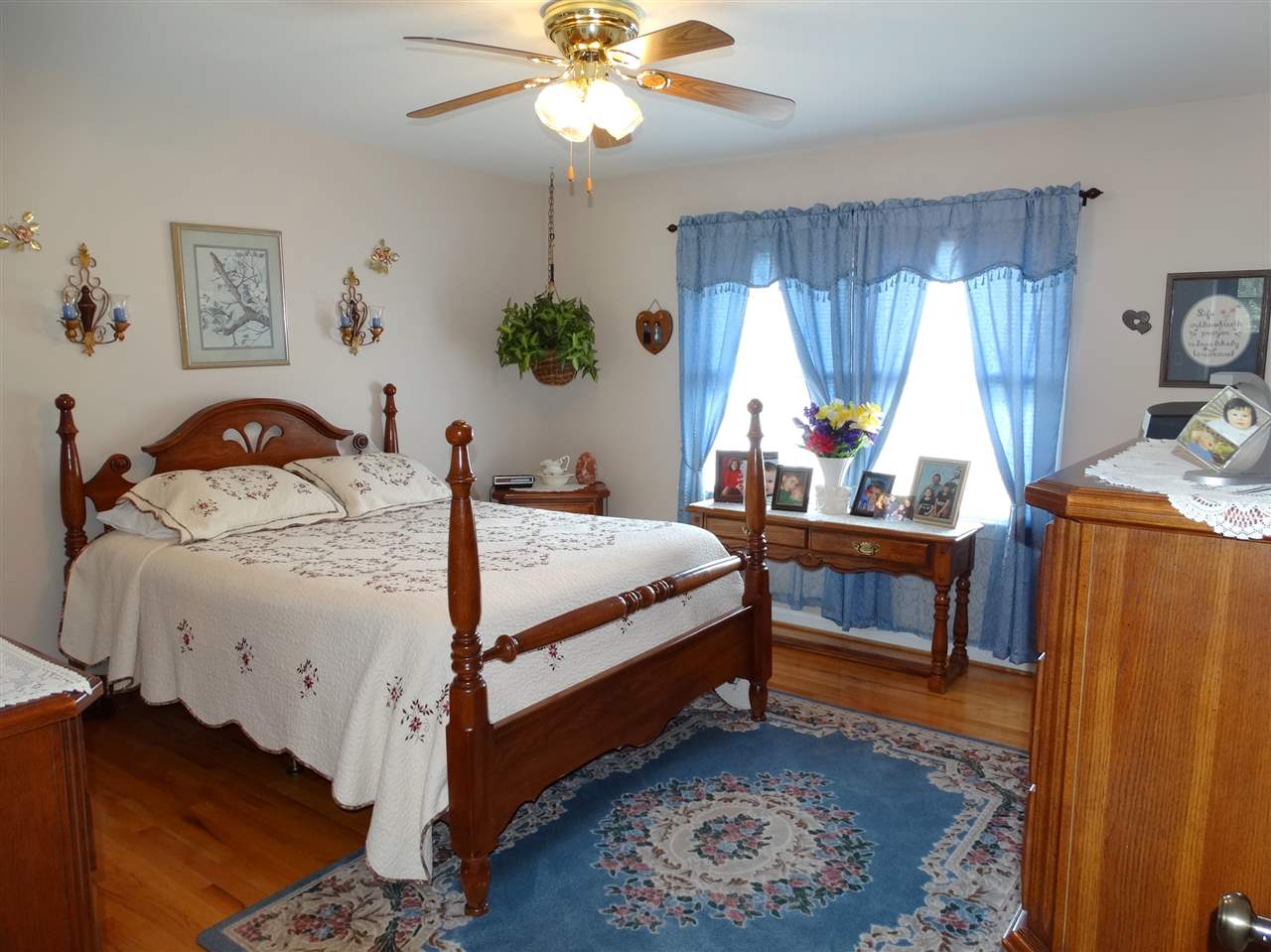 324 Good Hope Church Road Aroda, VA 22709 - Photo 20 of 32 a bedroom with a bed and a chandelier