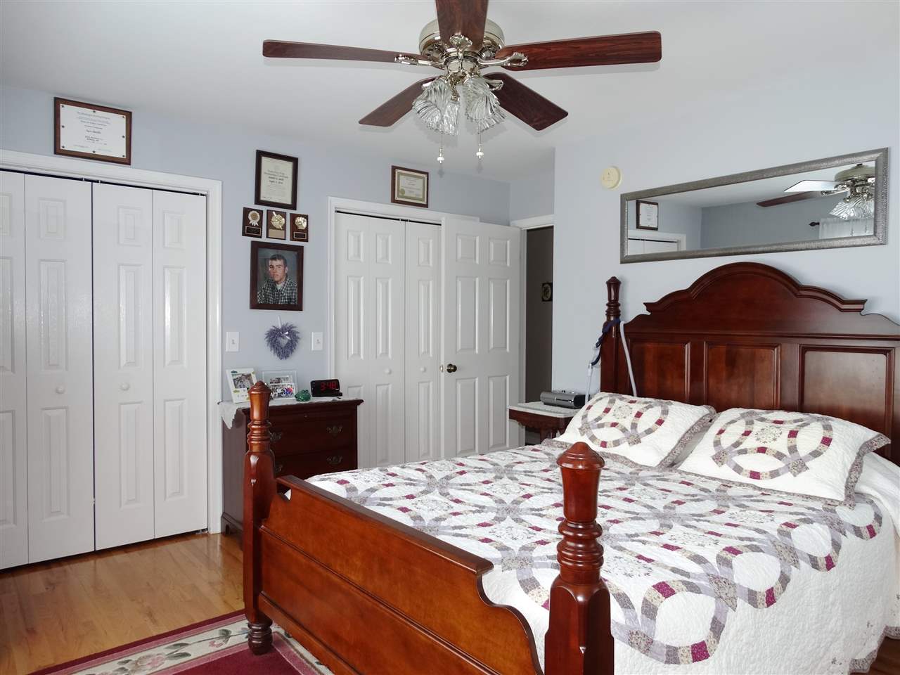324 Good Hope Church Road Aroda, VA 22709 - Photo 25 of 32 a bedroom with a bed and a chandelier