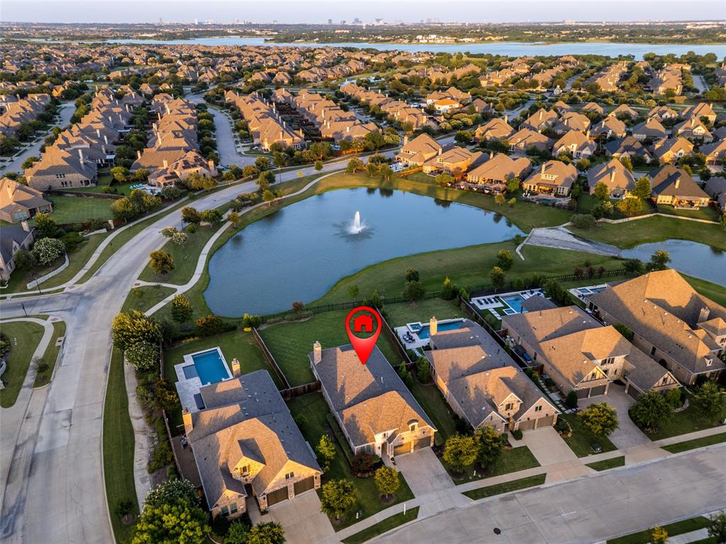 7821 Kentmere The Colony, TX 75056 - Photo 4 of 40 This beautiful home overlooks a tranquil canal complete with a charming fountain, creating a serene setting to enjoy from your backyard.