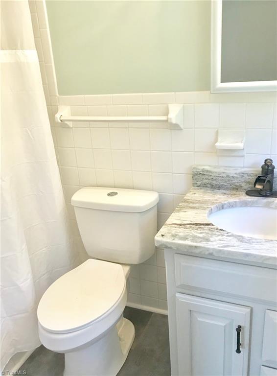 2629 Weymoth Road Winston-Salem, NC 27103 - Photo 15 of 22 Master Bathroom features new flooring, granite top, plumbing/lighting fixtures.