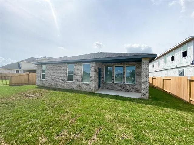 a view of a wrought iron fences in front of house