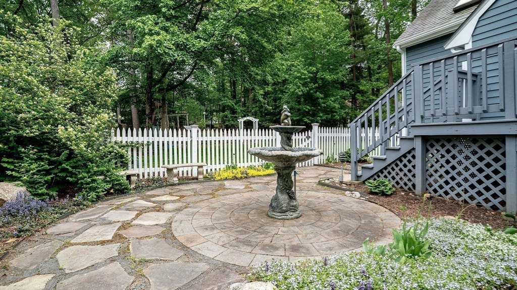 142 Baker Street Walpole, MA 02081 - Photo 38 of 42 a view of a fountain with wooden fence