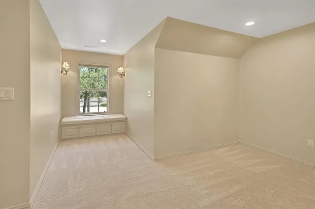 a view of a backyard and patio with fire pit