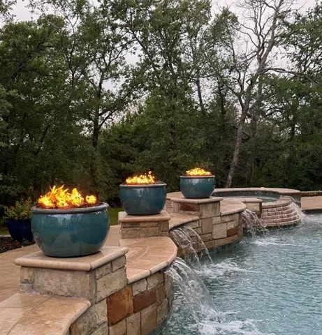 a view of swimming pool with a table and chairs