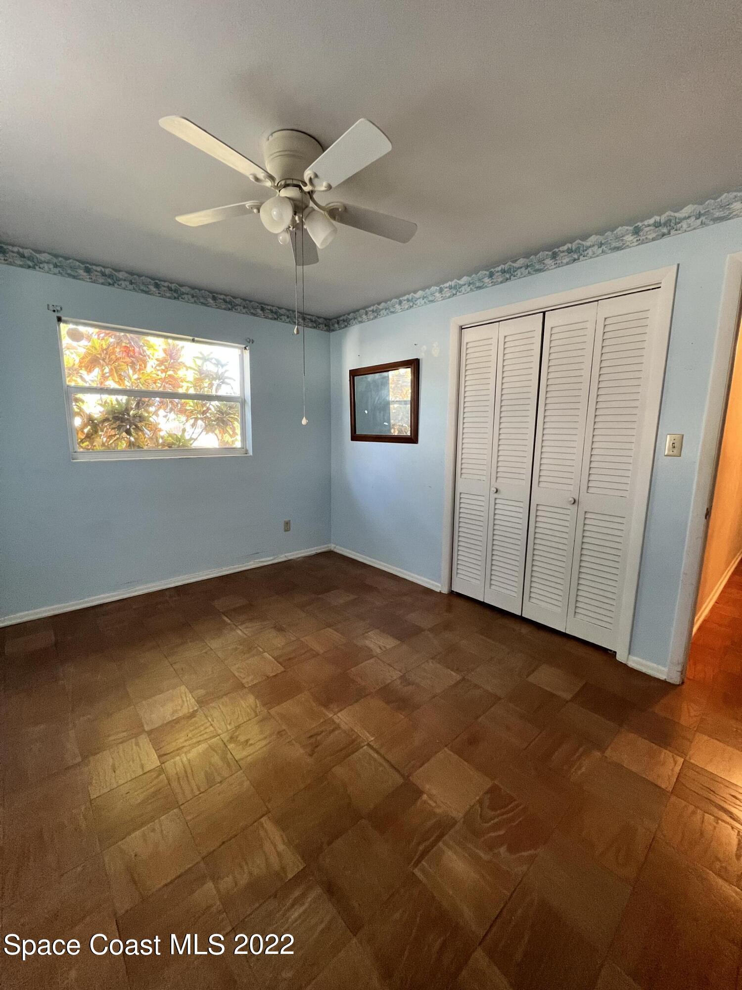 974 Macco Road Cocoa, FL 32927 - Photo 8 of 12 a view of an empty room with a window
