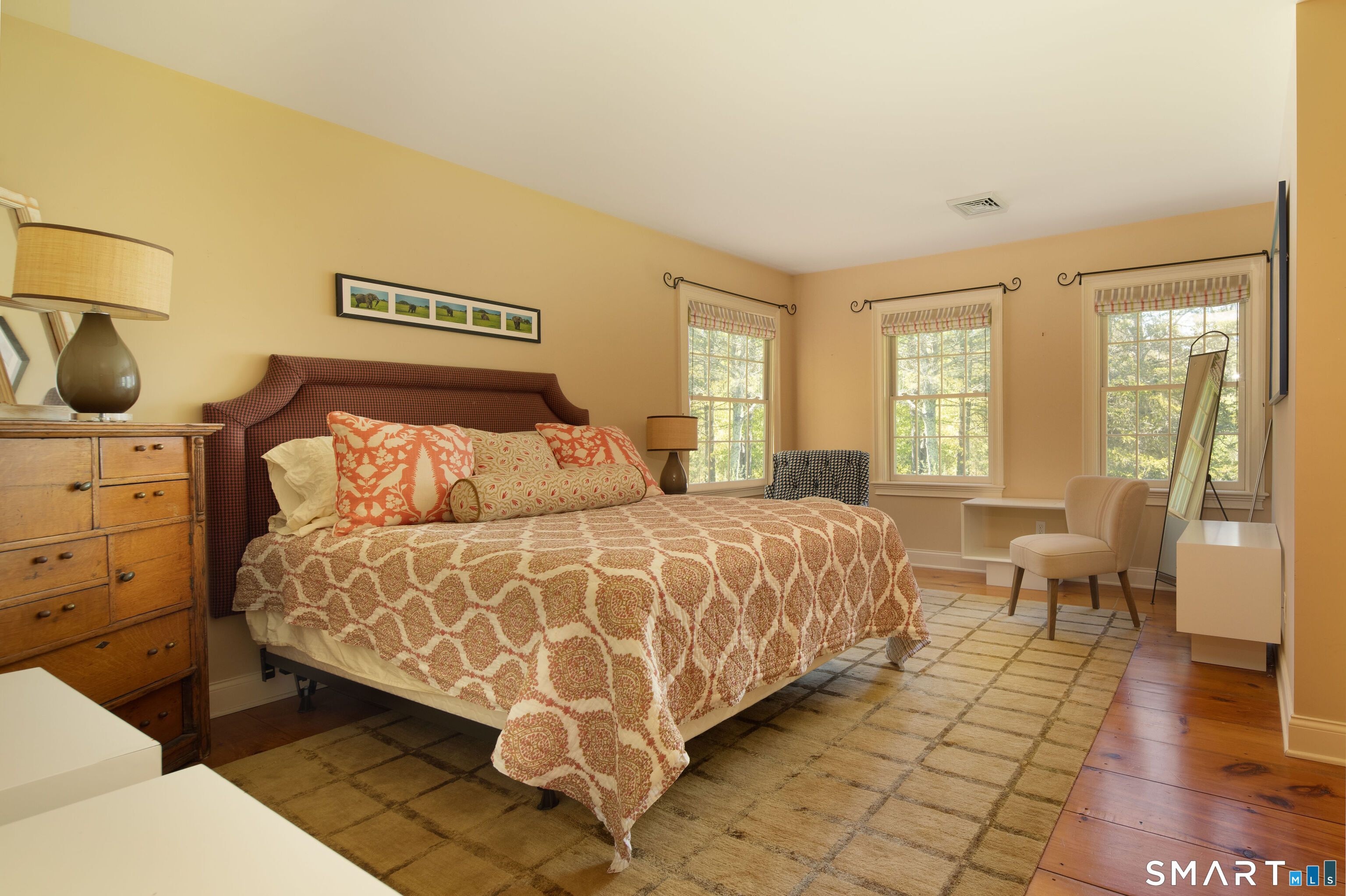 7 Cooper Hill Road Salisbury, CT 06068 - Photo 28 of 36 a bedroom with a bed and wooden floor