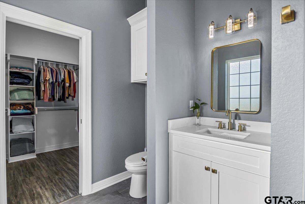 1603 Elk River Road Tyler, TX 75703 - Photo 22 of 43 a bathroom with a sink toilet and shower